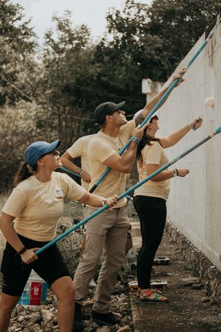 SPWR reps painting a wall