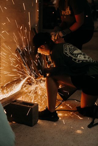 Sparks flying as a SPWR rep welds metal