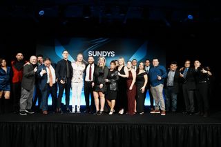 Group posing for a photo at Sundys