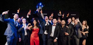 Group holding a trophy