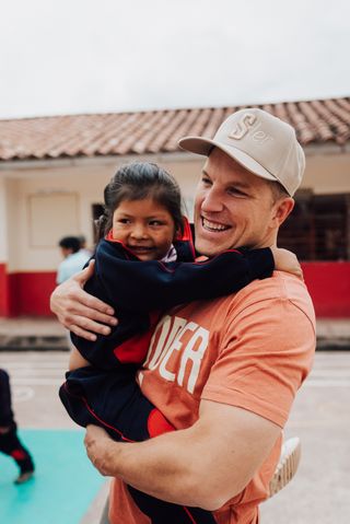 Max supporting a child