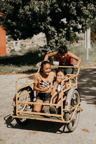 Children riding in a freight tricycle